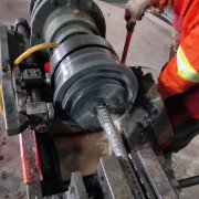 1、概述：全从动螺纹套丝机HH40型采用PLC控元实现